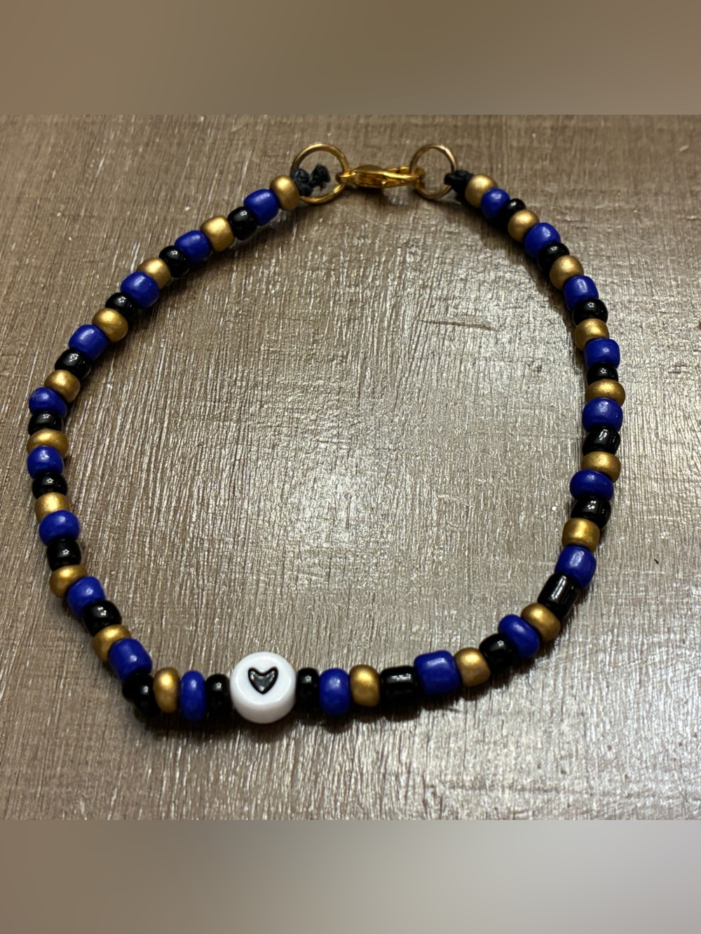 Handmade Blue, Black & Gold Beaded Bracelet with Heart Accent
